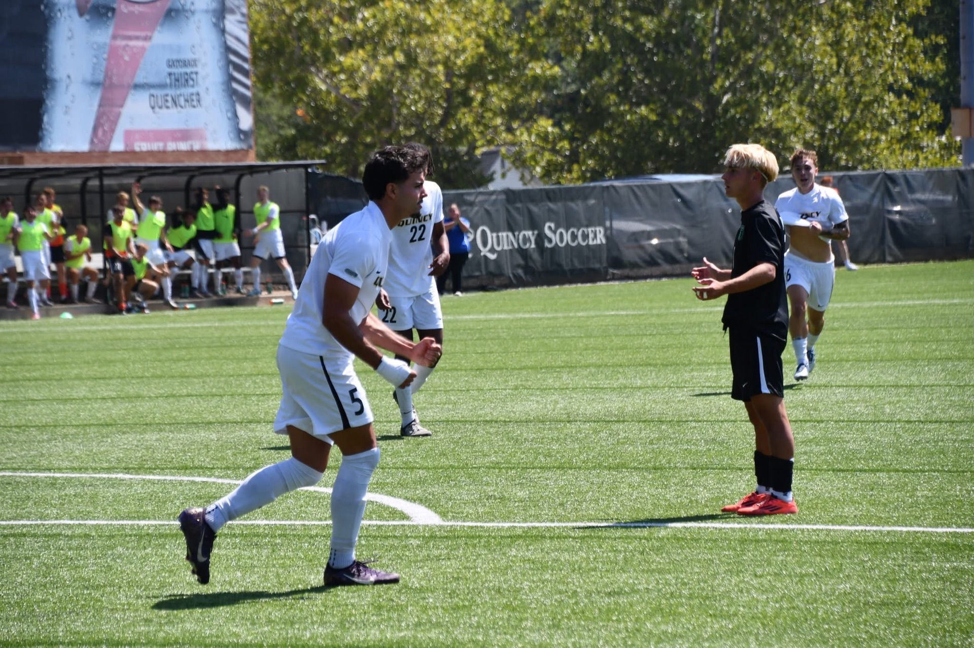 Carlos Moreno Henao celebrating with teammate